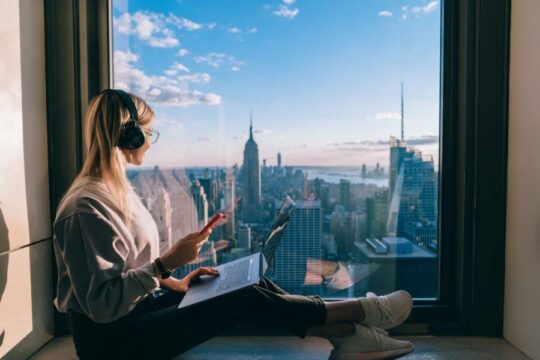 A woman sitting in a window in New York