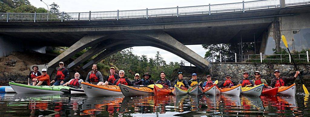 The Ocean River Team posing on their kayaks