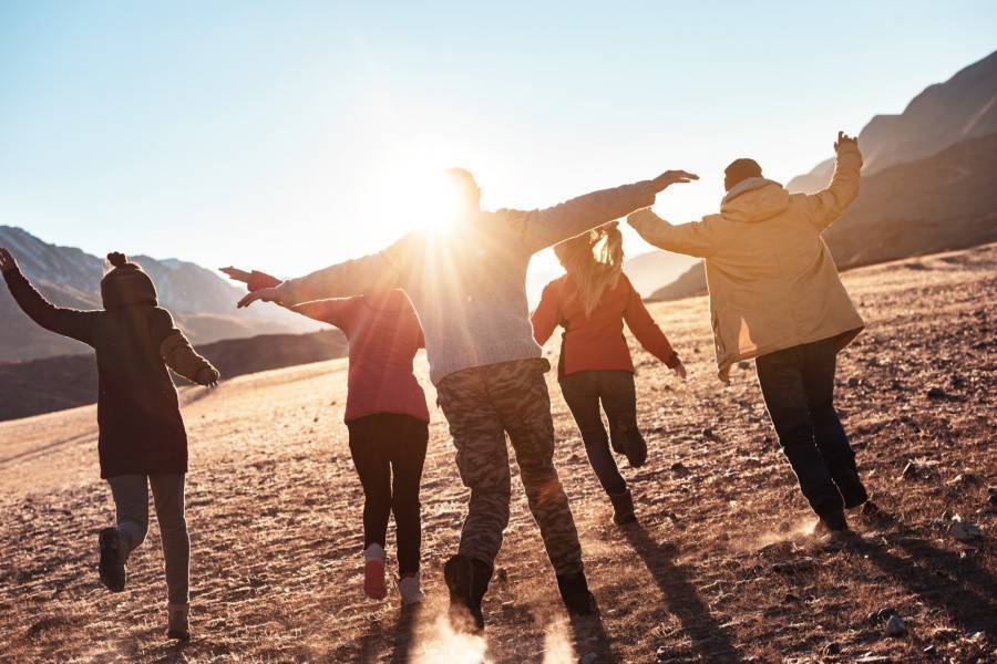 Running in a field with friends