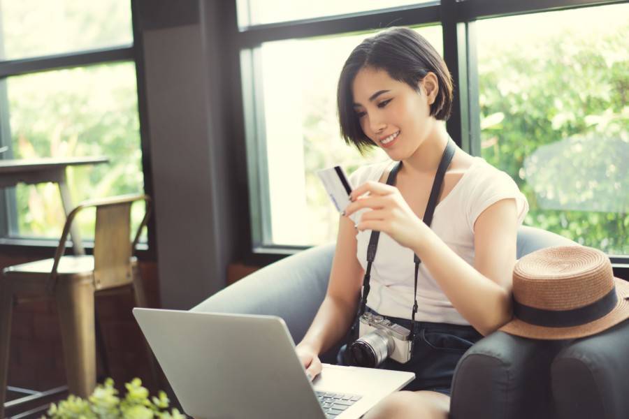 Person using laptop and mobile device