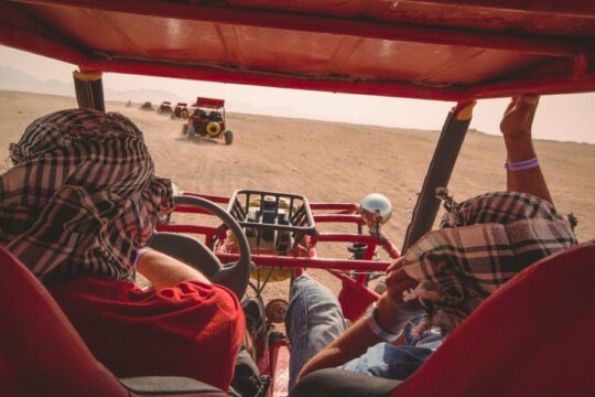 A convoy of buggies among the dunes