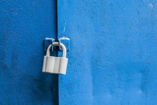 A lock on a blue door