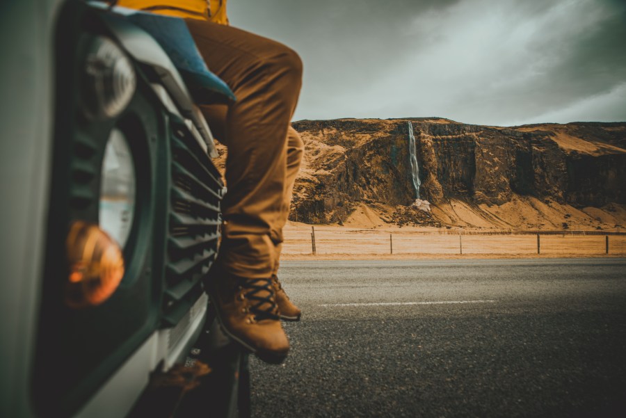 Sitting on the hood of a truck