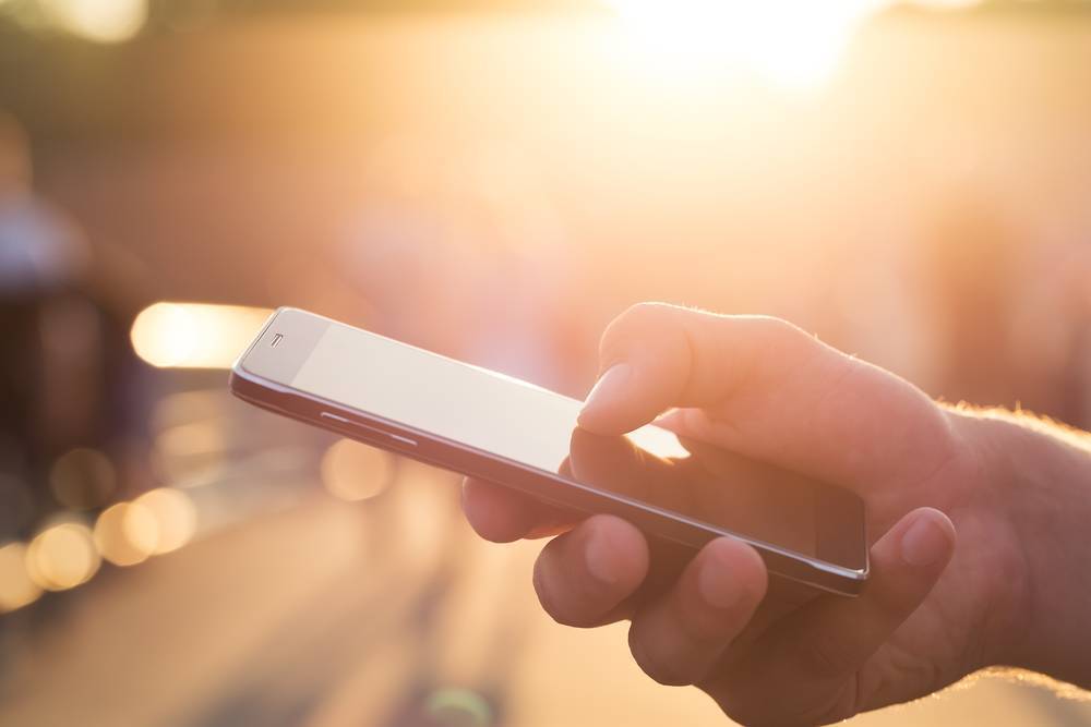 A closeup of somebody holding a smartphone