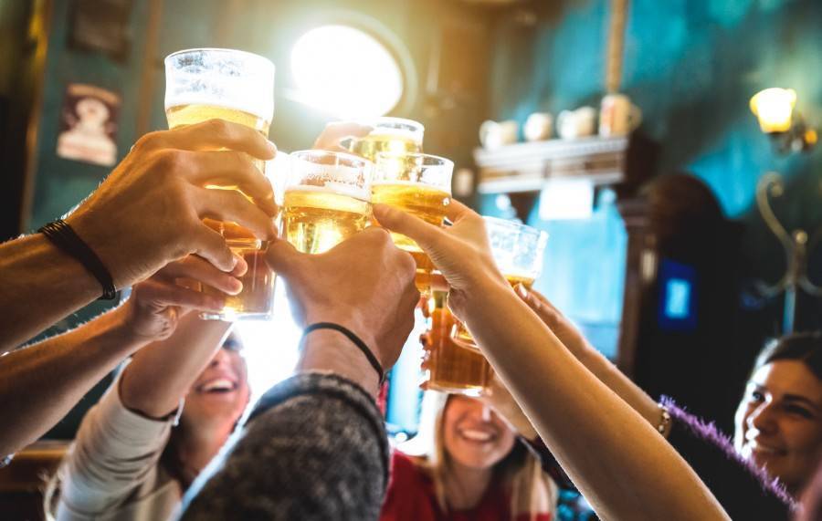 A group cheersing a round of drinks