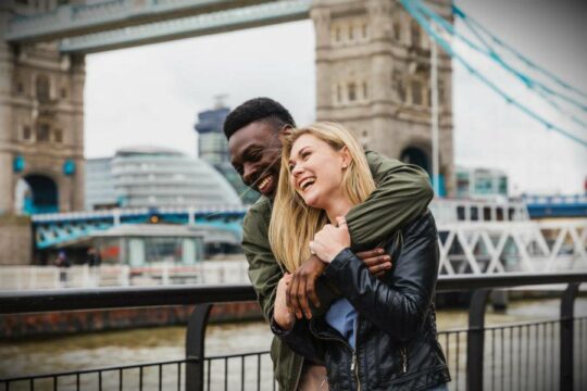 Couple hugging in a city