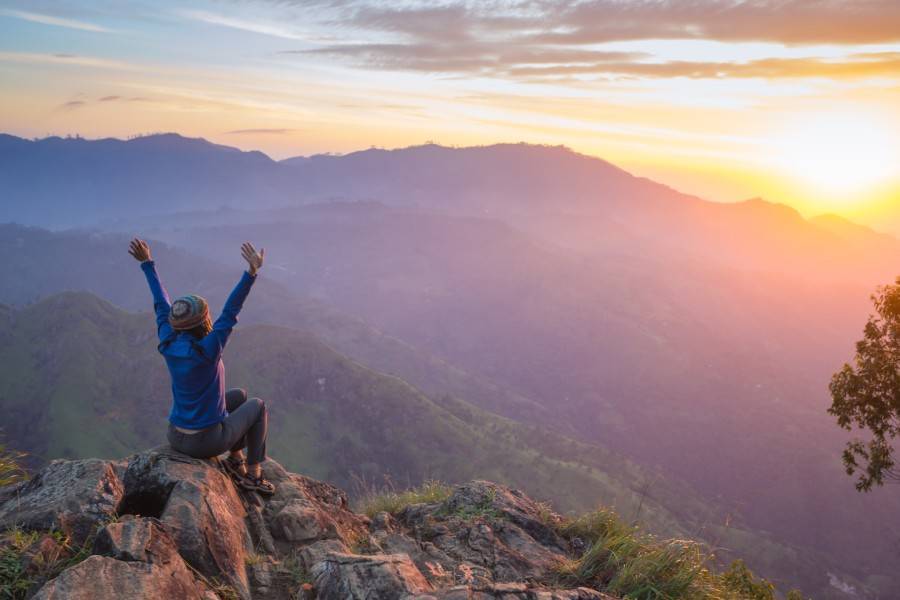 Feeling successful at the top of a mountain