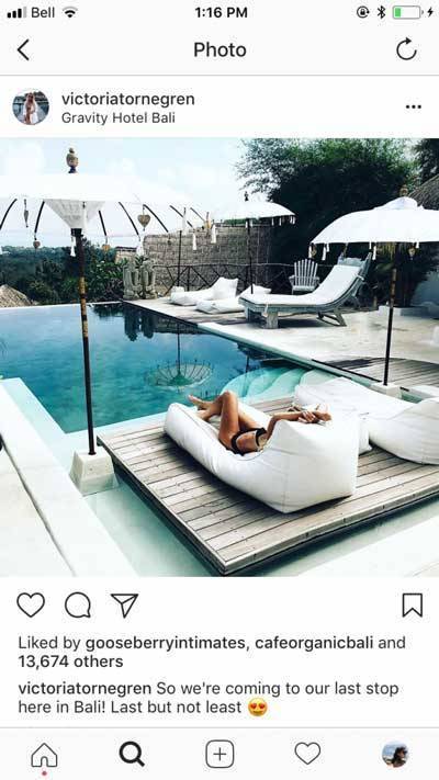 Instagram influencer post of laying on beach bag looking at infinity pool