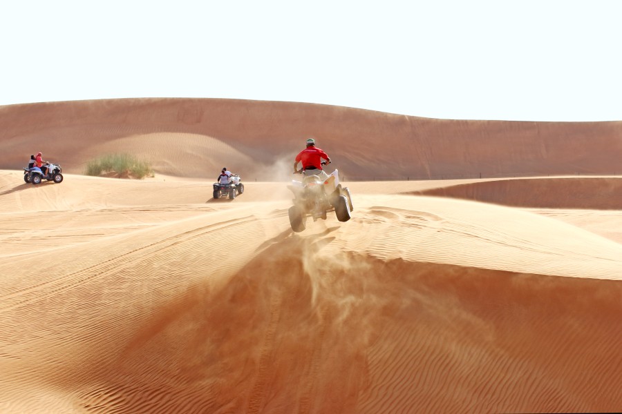 ATV riders driving around the desert