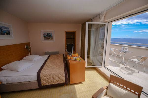 A hotel room with view of the ocean